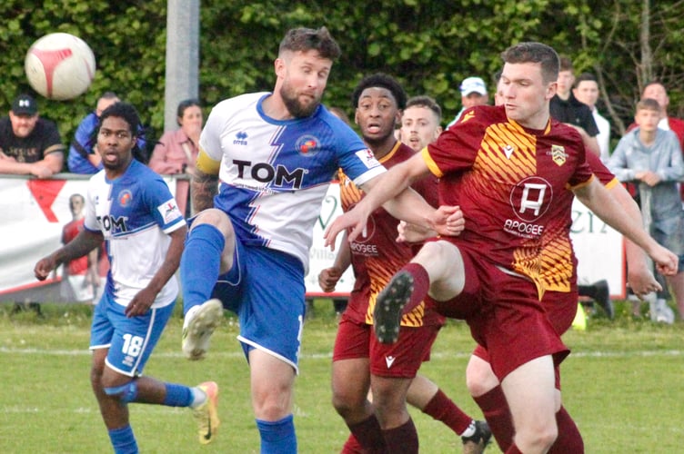 Chepstow and Corries players battle for the ball in the Ardal Southern Cup final