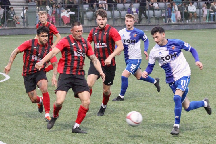 A Chepstow attacker tries to get round a posse of Albions defenders