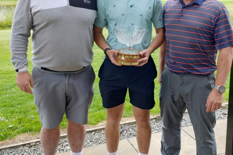 Eddy Annis and Ryelee Wilkins with the trophy presented to them by Vice Captain Steve Jones.