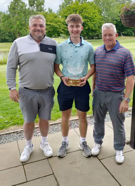 Eddy Annis and Ryelee Wilkins with the trophy presented to them by Vice Captain Steve Jones.