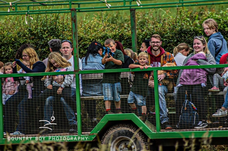 Enjoying a ride on one of the trailers.