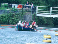 Crew rows Lydney skiff Emerald for the first time