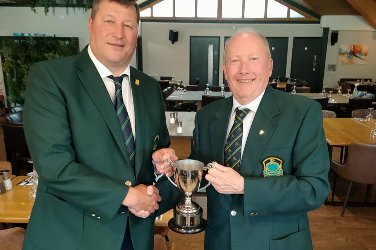 Mark Graham presents the Richard Mudge Memorial Trophy to Brickhampton Court's Chris Dooley.