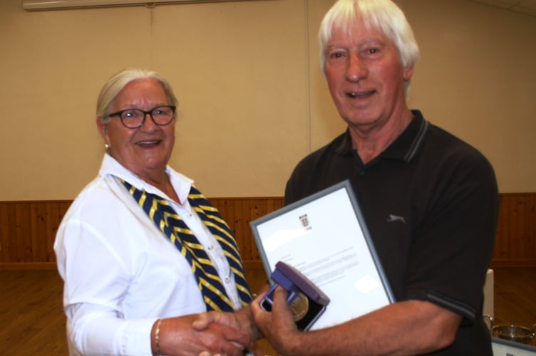 Dave D'Ambrogio is presented with his award by Sue Henson-Green.