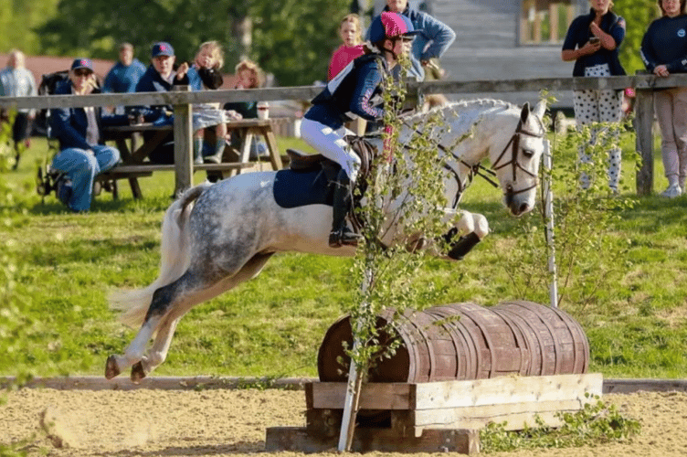 A Haberdashers' Monmouth rider clears the next obstacle
