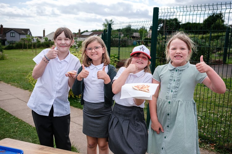 Pupils enjoying some pizza.