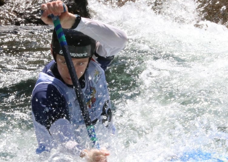 Jake Mitchell powers through the spray