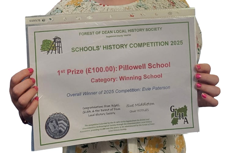 Pillowell Primary pupil Evie with the winnning school certificate.