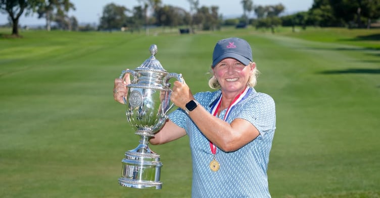 Becky Morgan proudly lifts the US Senior Women’s Open trophy