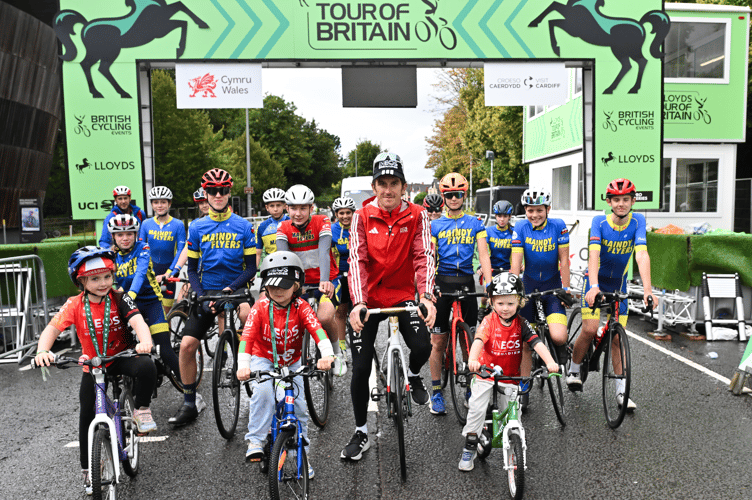 Picture by Bruce Rollinson/SWpix.com - 07/09/2025 - Cycling - 2025 Lloyds Tour of Britain - Stage 6: Newport to Cardiff - Geraint Thomas (INEOS Grenadiers) with riders from his first club the Maindy Flyers