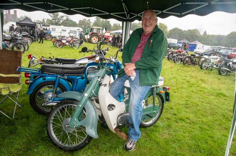 Terry Brown with a Honda C100 50 Cub motorcycle 