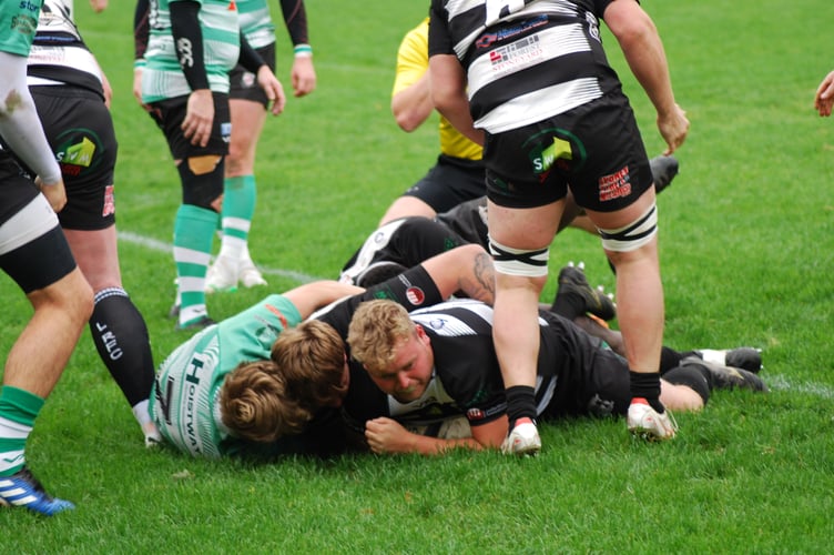 Rowan Mullis scores for Lydney. Picture: Roger Pike.