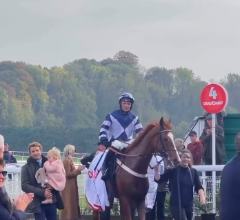 Sam Thomas with his daughter, left, is all smiles as Celtic Dino returns in triumph after landing the DragonBet Welsh Champion Hurdle.