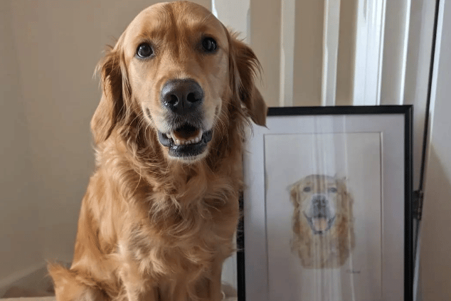 A dog beside a portrait of itself by Charlotte.