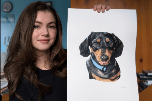Charlotte Mullins with one of her hand drawn pet portraits.