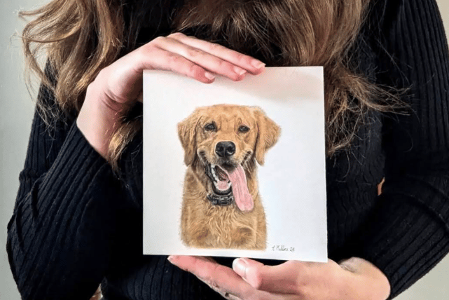 Charlotte showing one of her smaller portraits.