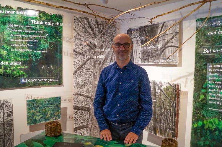 Artist John Slater with his “Forest’ installation
