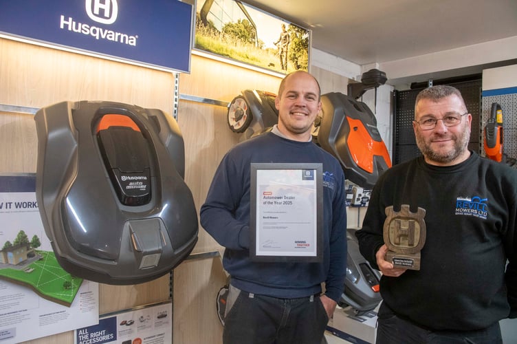 Russell (right) and Jason Revill with the award from Husqvarna.