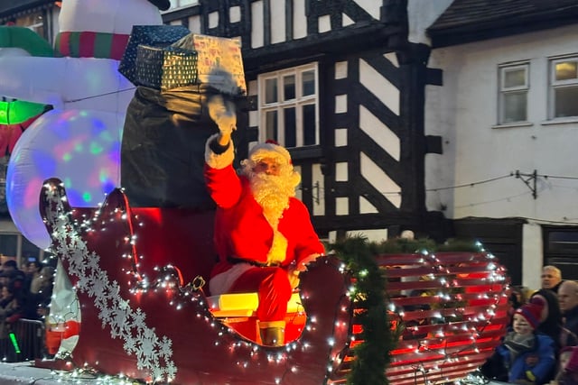 Father Christmas engages with the Newent crowds during the parade.