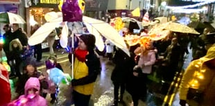 Lantern parade blazes a trail through wind and rain