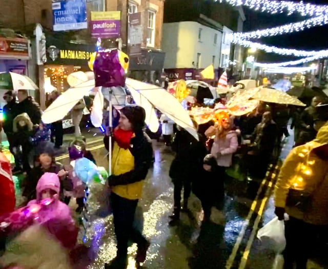 Lantern parade blazes a trail through wind and rain
