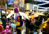 Lantern parade blazes a trail through wind and rain