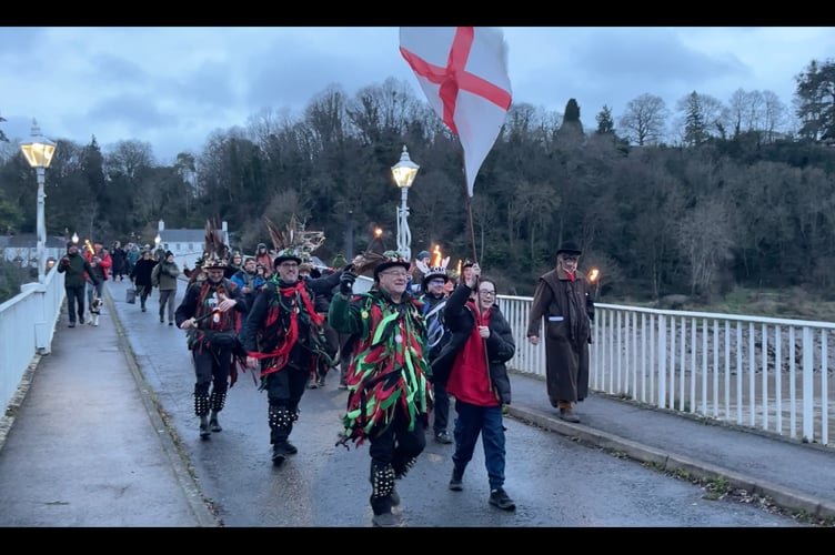 The procession makes its way into Wales across the Wye Bridge.