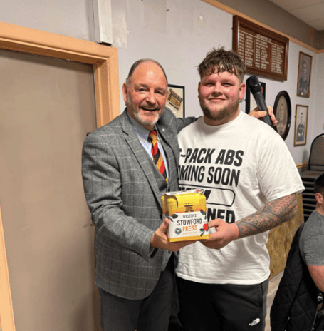 Mattie Cotton receives the Man of the Match award after an outstanding all-round display, with the presentation made by club president Pete Bell.