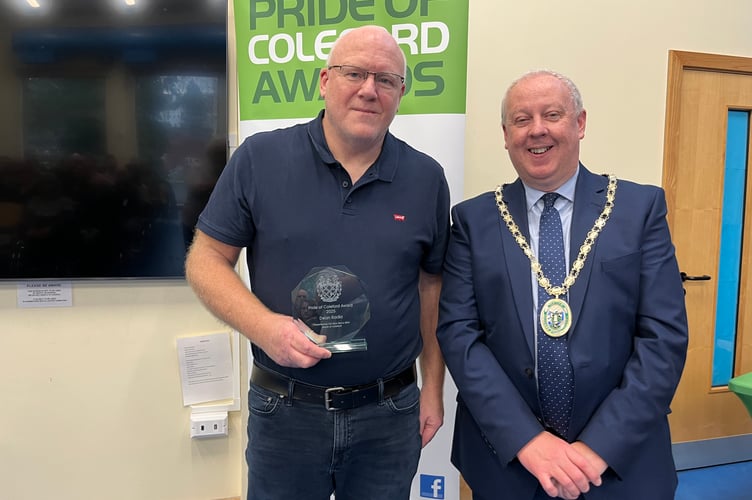 Presenter Andy Tooze accepts the award on behalf of Dean Radio.