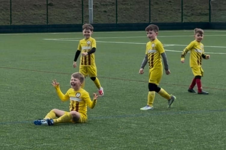 Theo Elliott enjoying his goal with teammates Devon, Blake and Oliver.