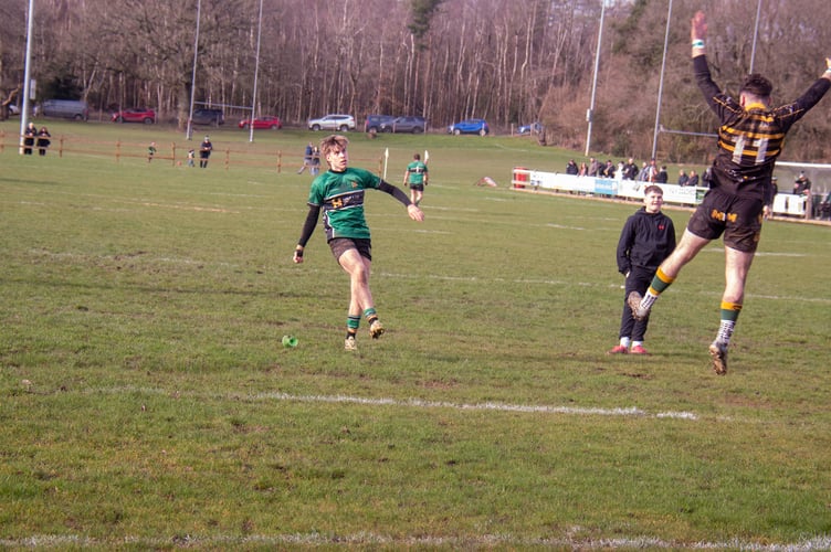 Harry Housley kicks a conversion for Drybrook.