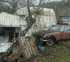 Council considers action as car collector defies removal order