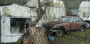 Council considers action as car collector defies removal order