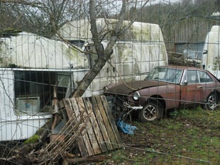 Council considers action as car collector defies removal order