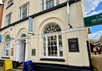 Duo charged with burgling Marches Deli