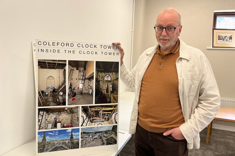 Coleford town councillor Matt Beard with a display showing the inside of the clocktower.