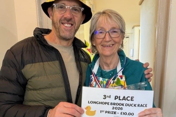 Jo Phelps, who won third place, with announcer Matt Phelps