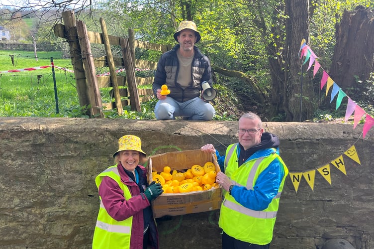 Finish line announcer Matt Armstrong and gatherers Vanessa Martin and Rob Knowles.