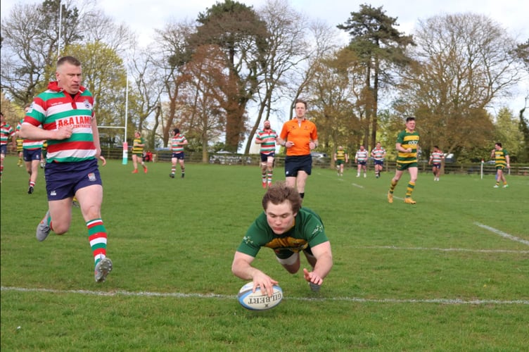 Dylan Leney scores for Newent. Picture: Georgina Gardner.
