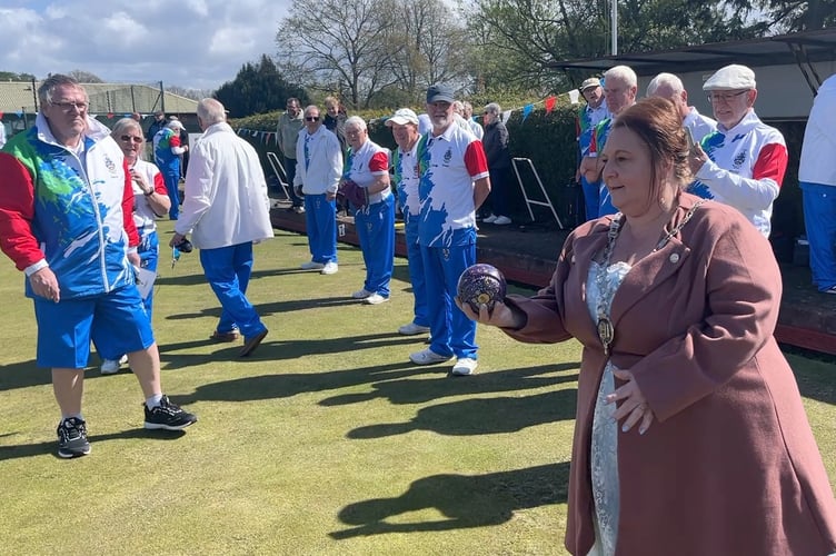 Mayor of Lydney Cllr Natasha Saunders prepares to send down the first bowl of the season.