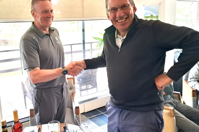 Seniors Captain Nigel Fullerton congratulates his Vice Captain Roger Bennett on his team's success