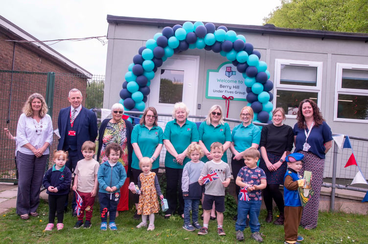 Former Chair Jo Revill, head of Five Acres high Simon Phelps, supporter Dot Sharp, playgroup assistant Shannon Davis, manager Margaret Bevan, deputy manager Jennifer Kennedy,, playgroup assistant Shaunna Lloyd, Lynsey Hawkins lead at Berry Hill Primary and acting head of the school Michaela Reid with some of the children.