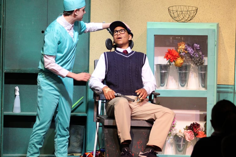 Evil dentist Orn Scivello (Will Allen) prepares Seymour (Evan Dzangare) for treatment.