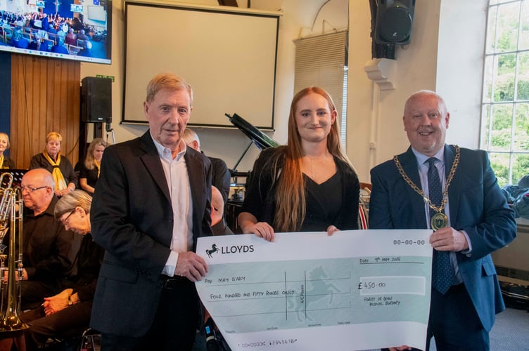 May D'Arcy is presented with a cheque by David Chaloner of the bursary committee and Mayor of Coleford Cllr Nick Penny.