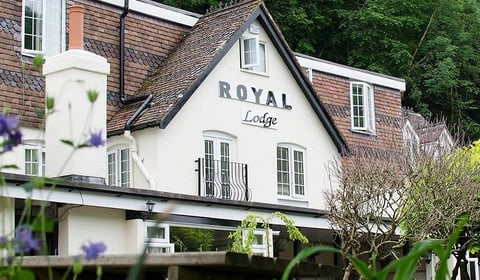 Riverside hotel hit by falling boulder from rock face