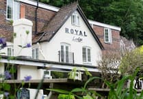 Riverside hotel hit by falling boulder from rock face