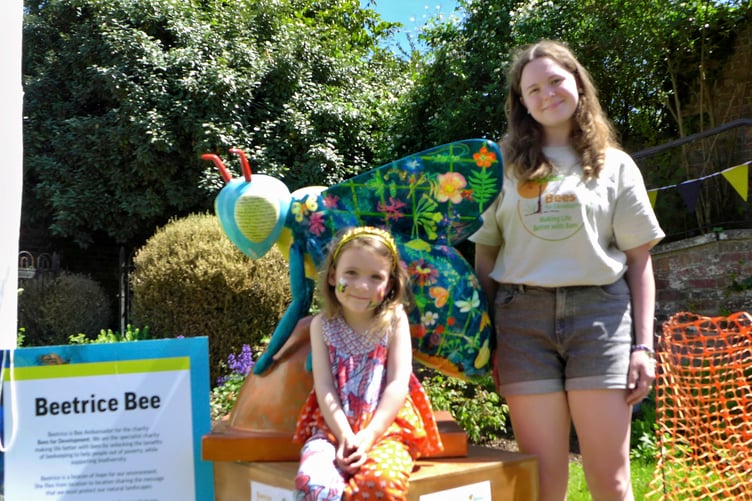 Sophia Oram, volunteer face-painter and Florence Harrold enjoying the afternoon