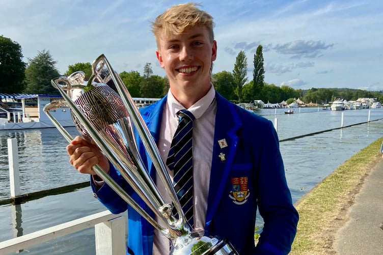 Tom Powell proudly holds the Prince Albert Cup after helping his Imperial College crew to victory at Henley Royal Regatta