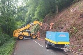 Netting work to prevent rockfall is taking place on the Wye Valley road