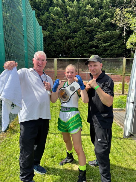 Natasha Wainwright with coaches Bryan Higgs (left) and Justin Wainwright.